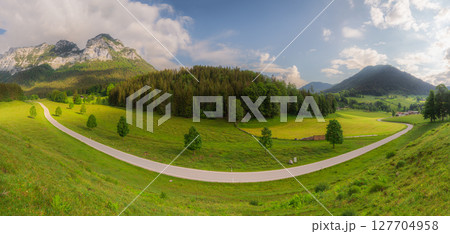 Meadow with road and bench during sunset in Berchtesgaden National Park Meadow with road and bench during sunset in Berchtesgaden National Park 127704958