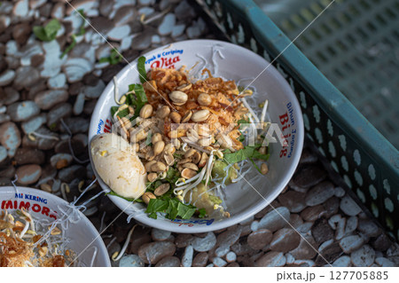 Savory Soto Ayam Dish with Various Toppings at Mataram, Lombok, Indonesia - September 1, 2024 127705885