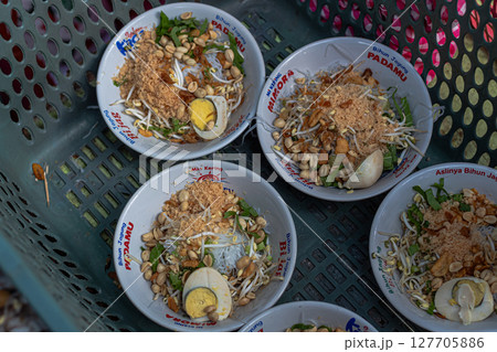 Savory Soto Ayam Dish with Various Toppings at Mataram, Lombok, Indonesia - September 1, 2024 127705886