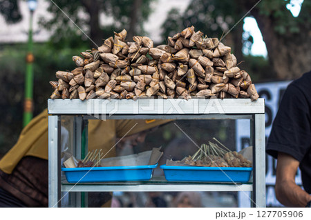 Traditional Indonesian Packed Meals and Skewers on Display at Mataram, Lombok, Indonesia - September 1, 2024 127705906