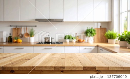 A modern home kitchen interior with contemporary wooden furniture, stylish decor, and a sleek counter with a sink 127706040