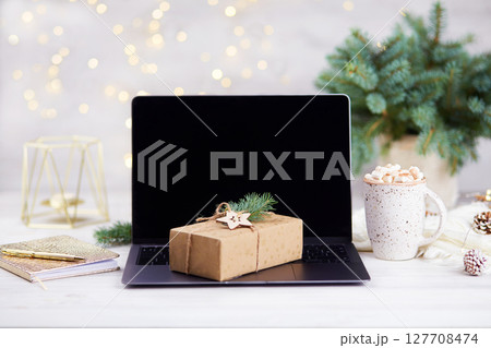 Shopping online for the Christmas holidays. 127708474