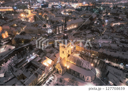 Aerial night View of Tallinn in winter, roofs are covered with snow, Christmas mood Aerial night View of Tallinn in winter, roofs are covered with snow, Christmas mood 127708639
