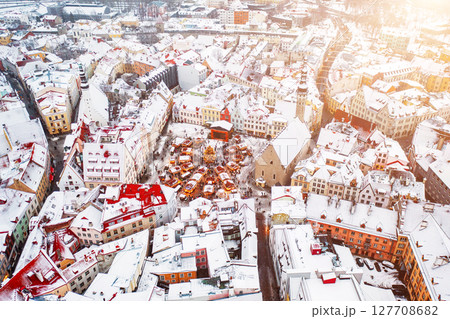 Aerial View of Tallinn with the Town Hall Square in winter, roofs with snow, Christmas mood 127708682