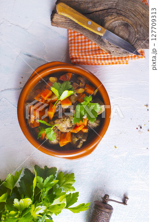 Fried chicken liver with onions and carrots 127709313