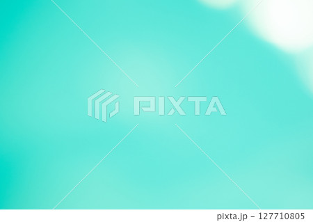 エメラルドグリーン系キラキラ背景素材　(写真素材) 127710805