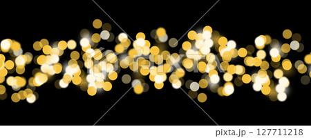 Soft bokeh lights in vibrant orange and gold, creating a magical, festive atmosphere for Christmas 127711218