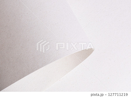 Soft, smooth white paper with a subtle speckled and mottled texture, made from recycled fiber. The 127711219