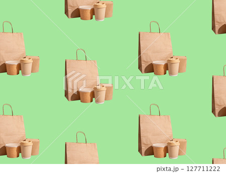 Sustainable takeaway food and coffee cups in kraft paper bag with recyclable packaging. Stylish, Sustainable takeaway food and coffee cups in kraft paper bag with recyclable packaging. Stylish, 127711222