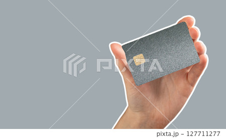 Bank card in hand, with plastic debit or credit card and chip for online purchase and payment. Close Bank card in hand, with plastic debit or credit card and chip for online purchase and payment. Close 127711277