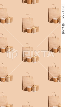 Eco friendly kraft paper bag and cup with takeaway food, reusable and recyclable packaging. Modern Eco friendly kraft paper bag and cup with takeaway food, reusable and recyclable packaging. Modern 127711318