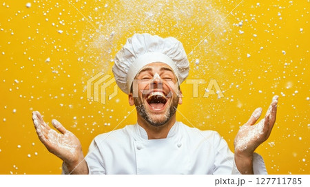 Chef joyfully celebrates while tossing flour in the air against a bright yellow background, showcasing culinary passion and bliss in a vibrant kitchen environment Chef joyfully celebrates while tossing flour in the air against a bright yellow background, showcasing culinary passion and bliss in a vibrant kitchen environment 127711785