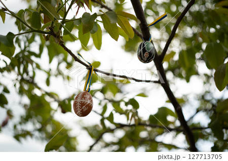 A beautifully painted Easter egg, decorated with vibrant colors A beautifully painted Easter egg, decorated with vibrant colors 127713705
