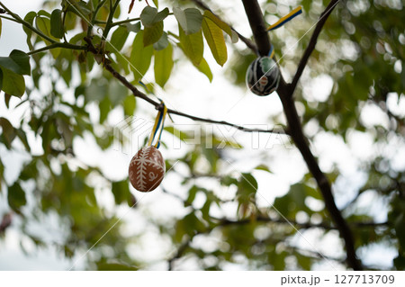 A beautifully painted Easter egg, decorated with vibrant colors A beautifully painted Easter egg, decorated with vibrant colors 127713709