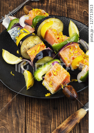 Shashlik from raw fish, ready to cook. 127713913