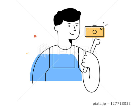 A happy male vlogger holds camera on selfie stick recording video content, representing modern social media content creation and digital technology engagement 127718032