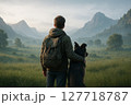 広大な風景を眺める男性と犬 127718787