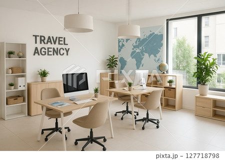 Modern travel agency office with minimalist design featuring computers, world map, and indoor plants for a relaxing work environment 127718798