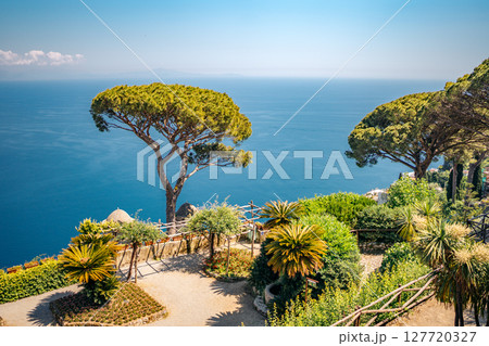 Ravello, Villa Rufolo gardens offer stunning Amalfi Coast views, attracting tourists seeking beauty.. 127720327