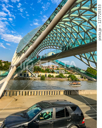 Side view of the Bridge of Peace in Tbilisi, Georgia. High quality photo Side view of the Bridge of Peace in Tbilisi, Georgia. High quality photo 127720333