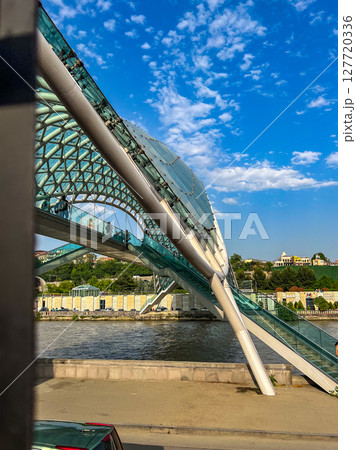 Side view of the Bridge of Peace in Tbilisi, Georgia. High quality photo Side view of the Bridge of Peace in Tbilisi, Georgia. High quality photo 127720336
