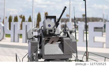 An automated weapons platform is showcased at a military exhibition, highlighting cutting-edge technology designed for tactical engagements in various combat zones. An automated weapons platform is showcased at a military exhibition, highlighting cutting-edge technology designed for tactical engagements in various combat zones. 127720525
