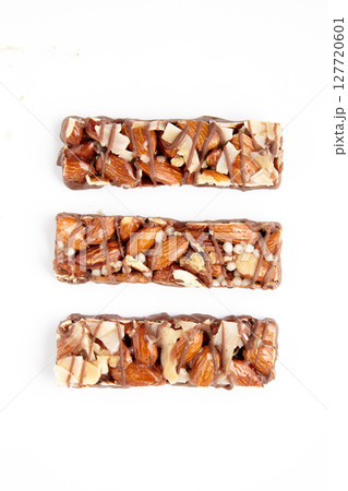 three caramel nut bars isolated on a white background. top view with copy space. 127720601