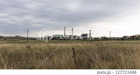 old USSR factory exterior, industry building is in a state of disrepair 127721486