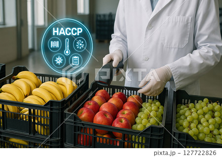 Scientist scanning bananas, apples and grapes in plastic crates during food safety inspection under HACCP guidelines with digital icons in modern facility 127722826