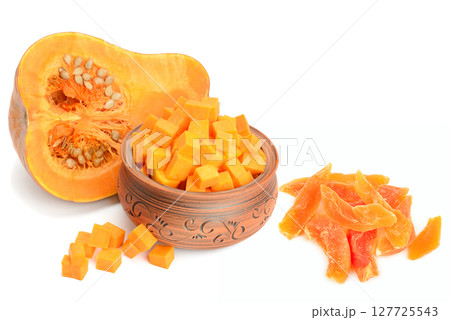 Pumpkin pieces, seeds and dried pumpkin pieces isolated on white background. Collage. Pumpkin pieces, seeds and dried pumpkin pieces isolated on white background. Collage. 127725543