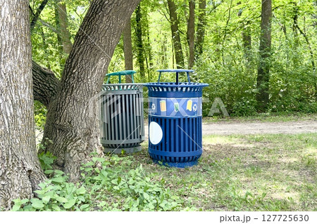 waste bins for separate waste collection in the park 127725630