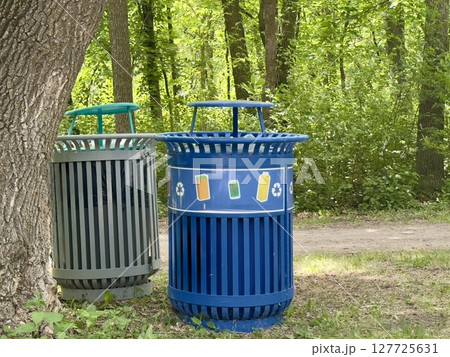 waste bins for separate waste collection in the park 127725631
