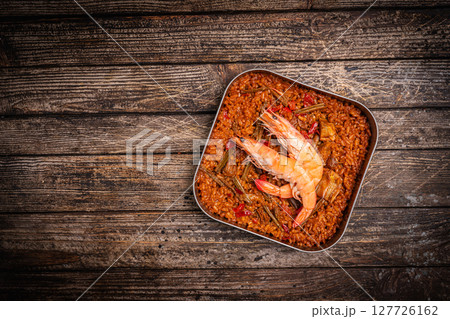 Spanish paella in a metal plate 127726162