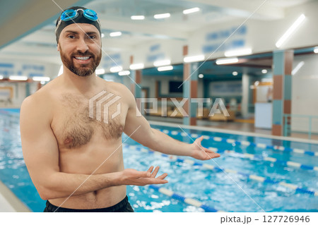 Man having a workout in the swimming pool Man having a workout in the swimming pool 127726946