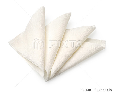 Four folded white paper napkins isolated on white background Four folded white paper napkins isolated on white background 127727319
