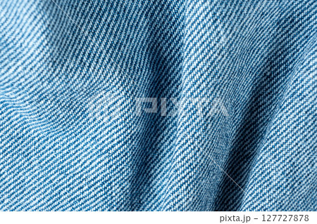 Denim Fabric with Organic Folds and Soft Shadows Macro. Pure Cotton Fabric. Denim Fabric with Organic Folds and Soft Shadows Macro. Pure Cotton Fabric. 127727878