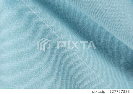Macro texture of blue fabric consisting of cotton with a slight addition of spandex. 127727888