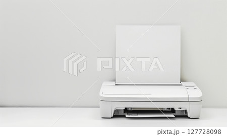 Modern compact printer with paper tray on white background in minimalistic office setting. concept of efficient office equipment, streamlined design, home workspace, copy space 127728098