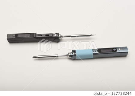 New electronic soldering irons with stingers. Modern tin soldering tools. 127728244