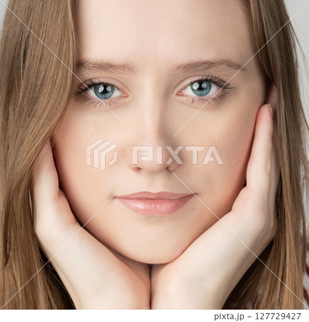 Beautiful long hair brunette woman studio portrait in white background Beautiful long hair brunette woman studio portrait in white background 127729427