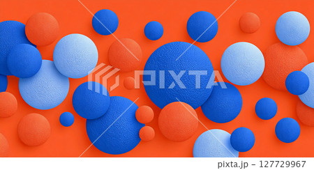 Colorful arrangement of textured blue spheres on vibrant orange background creates a modern abstract design with rich contrast and visual interest 127729967