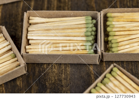 matchboxes with matches close up, open matchboxes with new matches made of natural wood 127730943