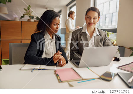 Participating in a Collaborative Business Meeting within a Modern Office Environment is essential Participating in a Collaborative Business Meeting within a Modern Office Environment is essential 127731792