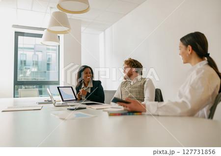 A Diverse Team Effectively Collaborating in a Modern Office Environment for Optimal Results A Diverse Team Effectively Collaborating in a Modern Office Environment for Optimal Results 127731856