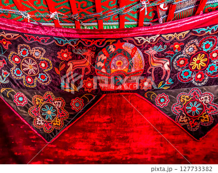 Interior decoration of the yurt. Living room with stove. traditional Uzbek yurt insideInterior decoration of the yurt. Living room with stove. traditional Uzbek yurt inside 127733382