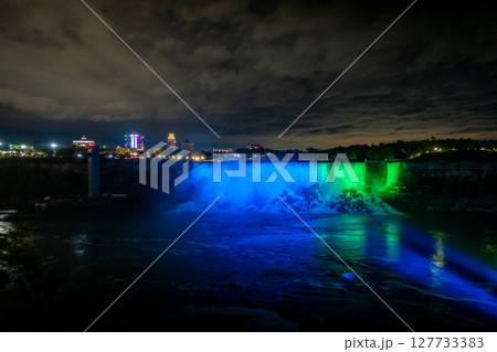 Niagara Falls frozen at night with colorful lights 127733383
