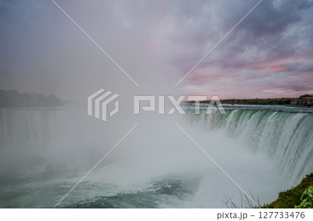 Canadian side view of Niagara Falls, Horseshoe Falls in a sunny day in Niagara Falls, Ontario, Canada 127733476