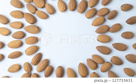 Tumbled raw almond background. Generated Image 127733631
