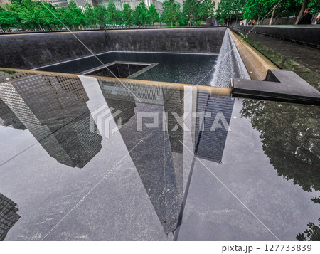 View of the twin towers memorial in New York City View of the twin towers memorial in New York City 127733839