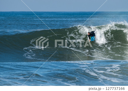 Bodyboarder surfing ocean wave Bodyboarder surfing ocean wave 127737166